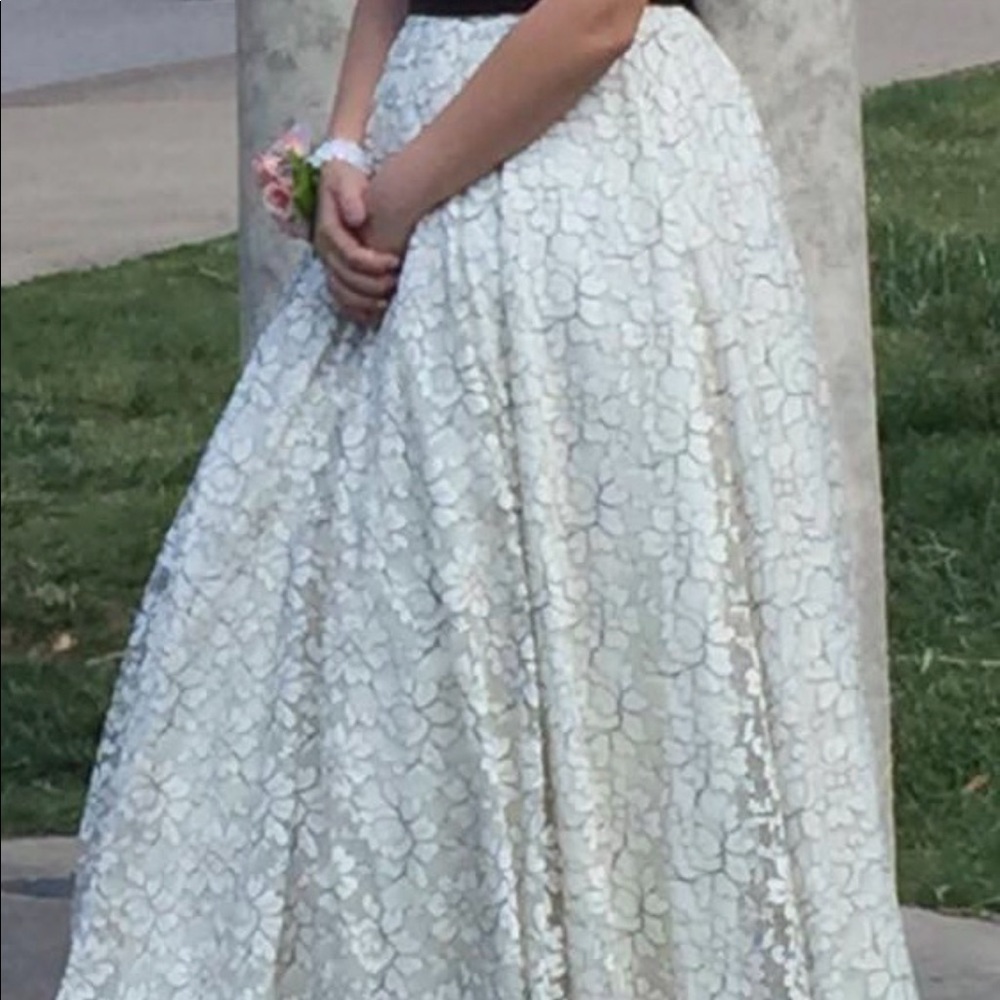 Full length dress. Has black lace trim and straps.